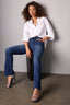 Blue Denim Brittany High Rise Contour Shape Technology Itty Bitty Boot Jean and Off White Long Roll Tab Sleeve Collar Neck Button Down Front Hi-Low Woven Top